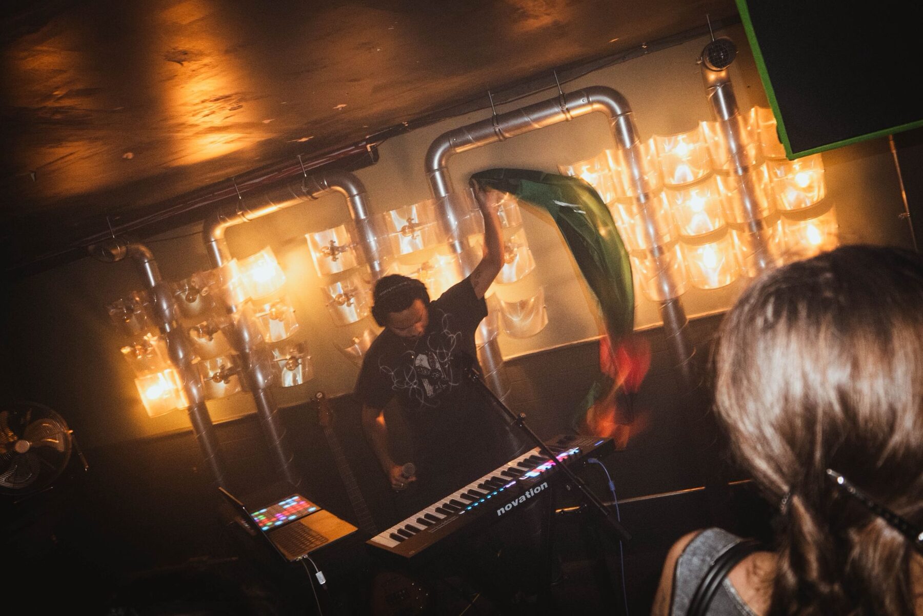 Performer waving a flag over the keys